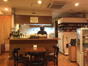 Part of the seating area, viewing the open kitchen at Tofu Room Dy's in Tokyo