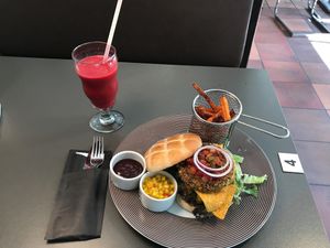 Vegan burger, sweet potatoes, strawberry and raspberry smoothie  at Smeltehuset in Odda