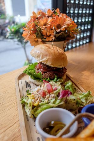 Cowboy burger with salad and fries at Mani Mani in Taipei