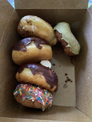 Two donuts 🍩 missing, but they all look so YUMMY! at Vegan Donut Gelato in Oakland