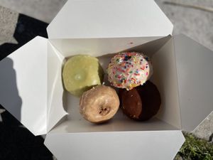 Clockwise from top: matcha, vanilla frosted, Boston creme and maple frosted  at Vegan Donut Gelato in Oakland