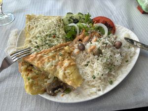 Mushroom ‘omelette’ with rice and salad  at Veggie Momi in Albufeira