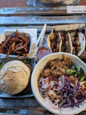 All vegan: tacos, fries, burger, and buddha bowl with udon. at The Burger Cafe in Tenerife