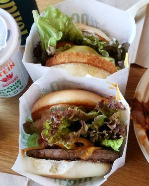 American burger with pepperjack and house sauce (bottom) and Chicken Bacon Ranch Sandwich (top). at Next Level Burger - Roosevelt in Seattle