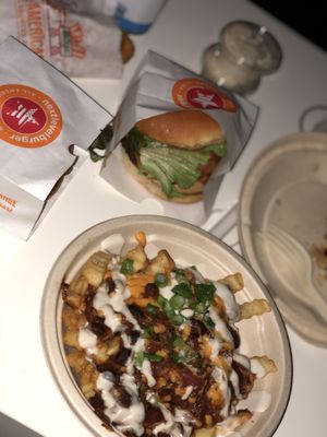 The “AMERICAN BURGER”, The “MAVERICK CLUCKWICH”, The “CHILI CHZ STYLE FRIES”, The “CLUCKERWINGS” & a “COOKIES N' CREAM” shake  at Next Level Burger - Roosevelt in Seattle