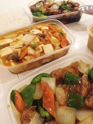 Takeaway goodies, vegan mock meat chicken in black bean sauce and satay mock chicken! Boiled rice and veggie vegan noodles...delicious! at New Happy Palace  in Gillingham