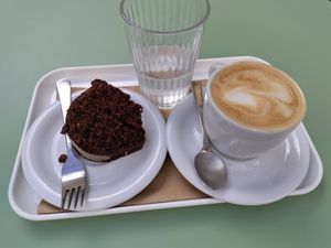 Oat milk coffee with espresso cake at Barbarella Juicebar in Ljubljana