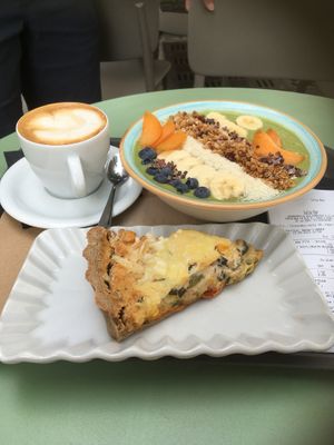Matcha smoothie bowl, quiche, coffee at Barbarella Juicebar in Ljubljana