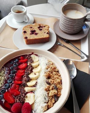 Açai bowl, melon and blueberry cake, espresso and chai latte soya at Barbarella Juicebar in Ljubljana