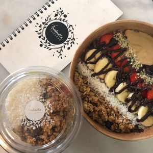 Soy yogurt with granola and oatmeal bowl with chocolate at Barbarella Juicebar in Ljubljana