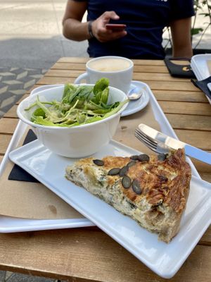 Quiche with spinach and leek + salad and rice mylk latte at Barbarella Juicebar in Ljubljana