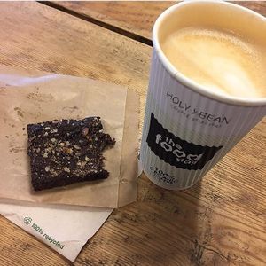 Oatmilk latte and raw brownie!  at The Food Stall - Train Station in Odense