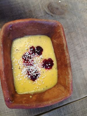 Unbelievable mango, coconut and quinoa mousse! With raspberries at Schizandra in Oaxaca