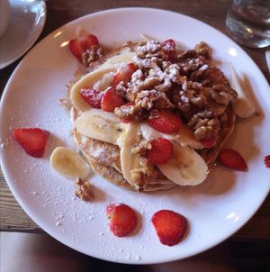 The BEST pancakes I've had... Ever. With added Strawberries, Banana and Candied Walnuts. (Vegan if asked for with Vegan spread instead of butter) at Satsang in Prague