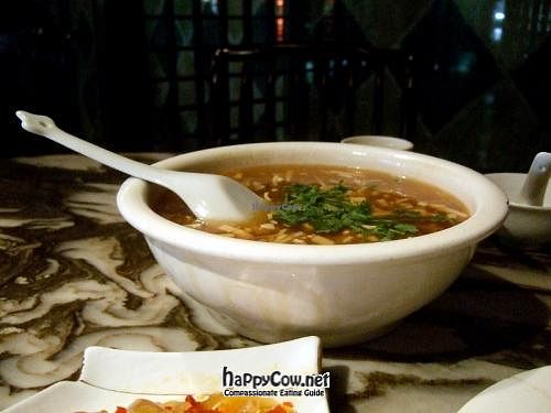 Hot and sour soup. This was huge, very cheap, and  and very tasty. Recommended. Foreground: pickles. at GōngDé Lín - Godly - Nanjing Rd in Shanghai