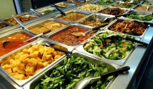 A fantastic place filled with fresh cook veggies, mock meats, sweet and sour, rice and soup.

This is a fantastic place to eat, very central, cheap and with an impressive variety every day. And let's not forget the Chinese stuffed steamed breads! at Ee Beng Vegetarian Food 毅明素食 in Penang