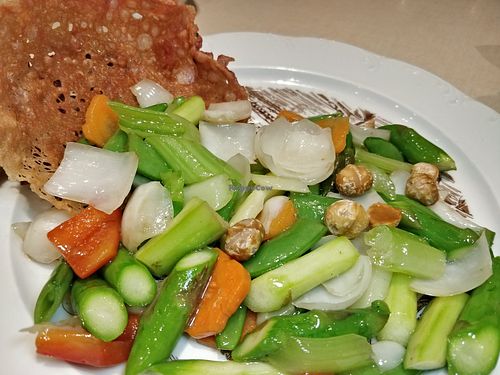 Sautéed asparagus macadamia nuts and fresh lily bud in crispy basket at Ling Zhi Restaurant 灵芝 - Orchard in Central Singapore