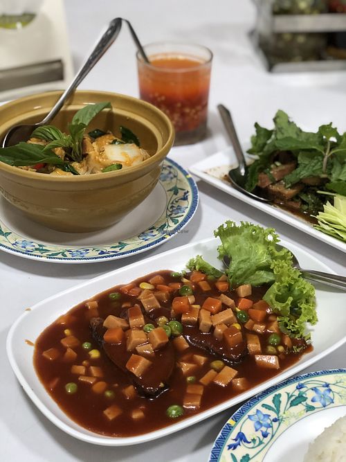 Vegan ham and fish in spicy sauce, vegan seafood curry, vegan nam tok salad at Ruyi Vegetarian in Bangkok