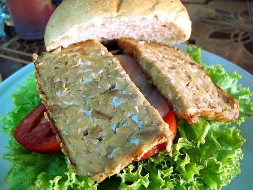 Tempeh burger. It would be nicer if tempeh would be marinated to add some taste to it.  at Aum in Chiang Mai
