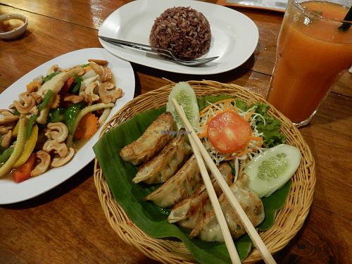 Veggie gyoza, fried vegetables and cashew nuts, brown rice and papaya shake. at Aum in Chiang Mai