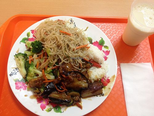 Rice base with broccoli, noodles and spicy eggplant plus a cup of soy milk on the right at Pure Vegetarian - Total Vegetarian - Stall in Adelaide