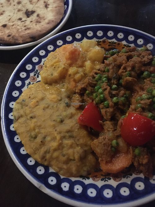 Seitan stew with lentil dhal and veggies, naan bread  at Bio Bistro Spicy Spices in Salzburg