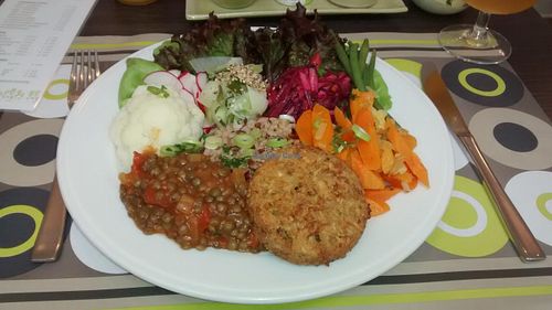 Dish of the day: cereal and vegetable steak, red and brown rice, lentils, cauliflower, celery, radishes, green beans, green salad, carrots. at De Bron - Pre-order only - Maybe closed in Bruges