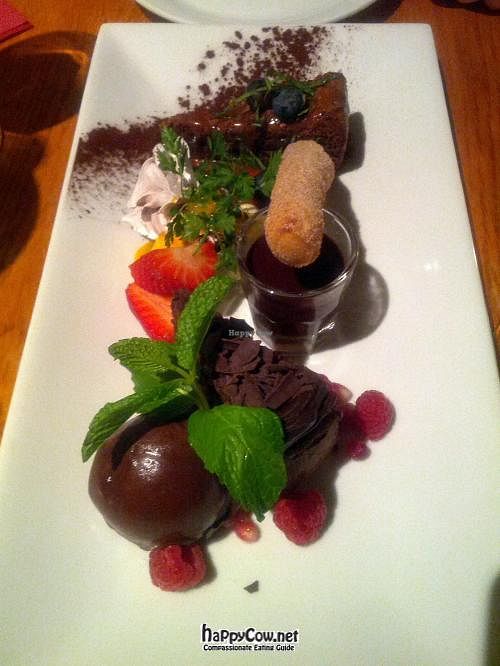 Chocoholic: Chocolate and hazelnut tart. Mini chocolate meringues. Sticky dipping chocolate churros, chocolate truffle cake and a chocolate sorbet. at Terre a Terre in Brighton