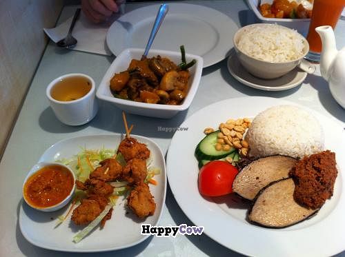 Veggie Ji Skewers (veggie soya chicken with satay sauce), Rendang Curry (veggie mutton curry), Sweet & Sour Veggie Prawn, Steamed Rice & Nasi Lemak (veggie fish steaks, veggie shrimp paste, steamed rice, peanuts, salad) at Veggie World in Milton Keynes