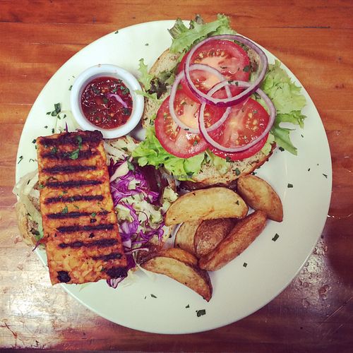 Tempeh burger with chunky wedges and salad at Alley Cafe Bar in Nottingham
