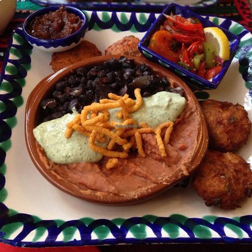 Mexi Trio: Cuban and refried beans over rice with Peruvian green salsa at El Piano in York