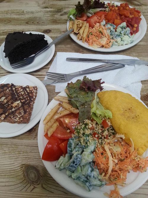 Jamaica pattie with salad, roast butternut squash, chick pea and red peppee bake, both served with salads. peanut butter blondie and dark choc cake at Blue Moon Cafe in Sheffield