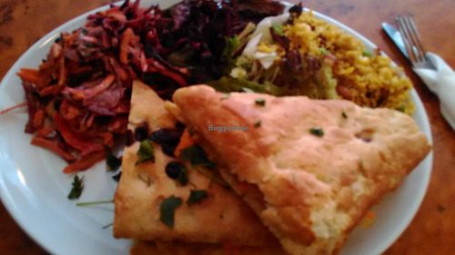 Marinated tofu sandwich on olive bread with rice and salad. at Herbies in Exeter