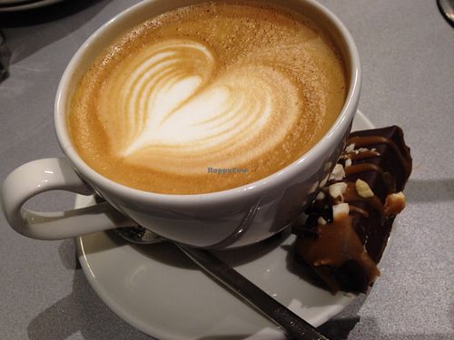 Caffe latte and raw vegan dessert about 8 euro. at Silvoplee in Helsinki