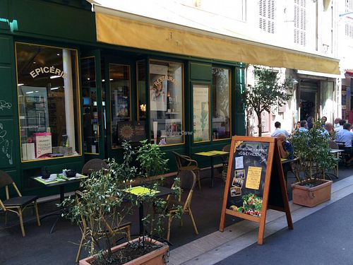 Patio and indoor seating for the tea room at the front of the store (pastries can be selected from a case inside). at Country Life in Marseille
