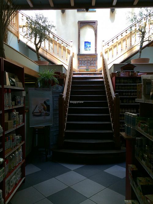 Staircase at the back of the store leading to the restaurant on the upper level at Country Life in Marseille