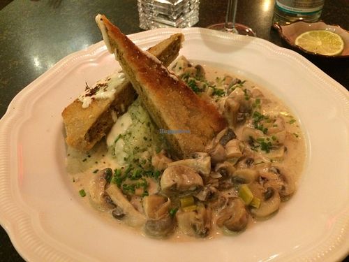 Mushrooms in a cream sauce with crispy housemade seitan and risotto with bears' garlic. So good! at Hiller in Hannover