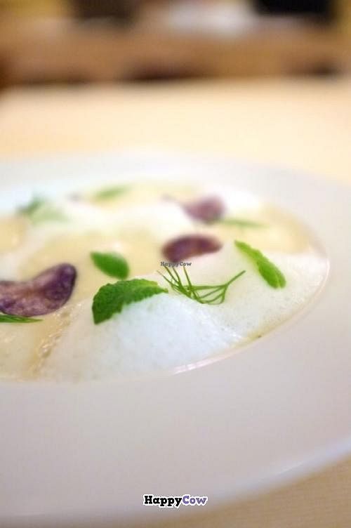 Excellent soup, potatoes cream with truffle mousse and purple potatoes chips, his name is 'Omaggio a Gualtiero Marchesi' at Joia Alta Cucina Naturale in Milan