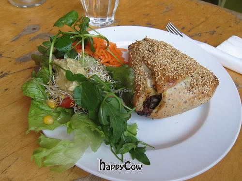 Vegan curry-stuffed 'croissant' with fresh side salad.  at Bolhoed in Amsterdam