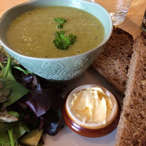 Delicious vegan pea soup served with salad and rustic bread at The Farm Shop & No 8 Cafe in Bembridge