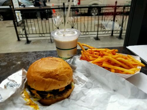 Classic burger with salted Carmel Shake and BBQ seasoned fries. at PLANTA Burger in Toronto