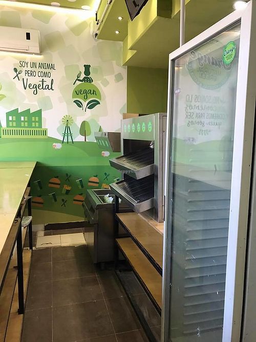 Side view of kitchen behind counter
 at Orange Natural Green in Buenos Aires