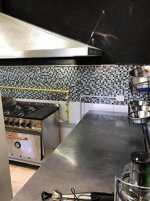 Stove, kitchen visible at Orange Natural Green in Buenos Aires