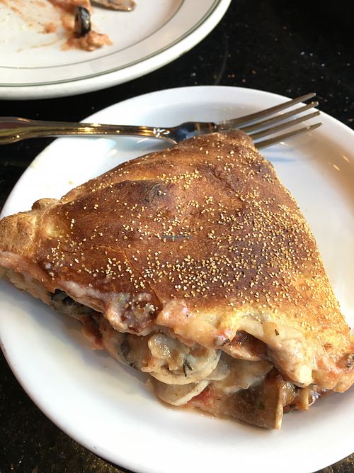 Half of the vegan Calzone (with house made cashew cheese mushroom olives and soy chicken. You can customize it. at CyBelle's Front Room in San Francisco