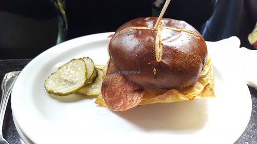 Vegan twice as nice sandwich: two mung bean eggs, two pieces of bacon, and cheese on a pretzel bun at CyBelle's Front Room in San Francisco