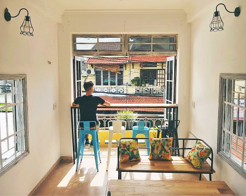 Sitting upstairs and enjoying the street ambient!  at Blended Wellness Smoothie Bar in Hoi An