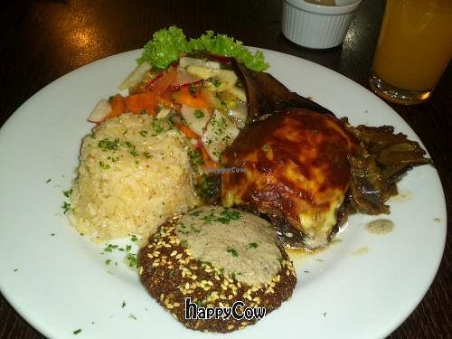 Salad, white rice, egglant lasagna and falafel, with passionfruit juice. at Bulever Sésamo in Bogota