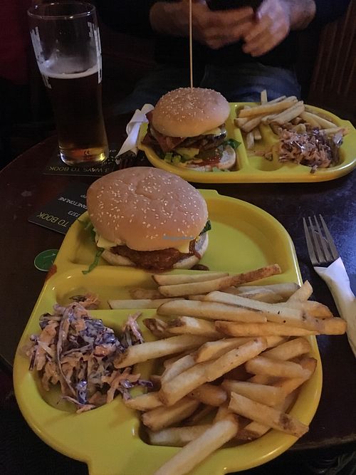 Bacon cheeseburger (back) and a vegan version of KFC sizzler (front) at The Caledonia in Liverpool