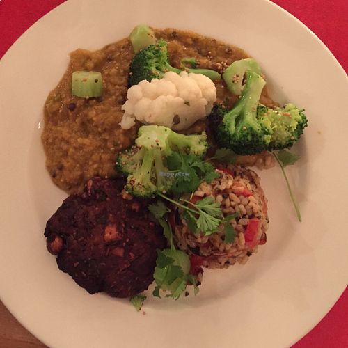 Moroccan lentil curry, apricot/tempeh burger, fries brown rifle with olives/tomatoes, broccoli and cauliflower at De Waaghals in Amsterdam