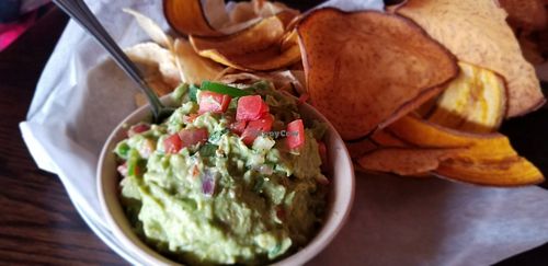 Guacamole with plantain and taro chips at Bomba Tacos & Rum in Fairlawn